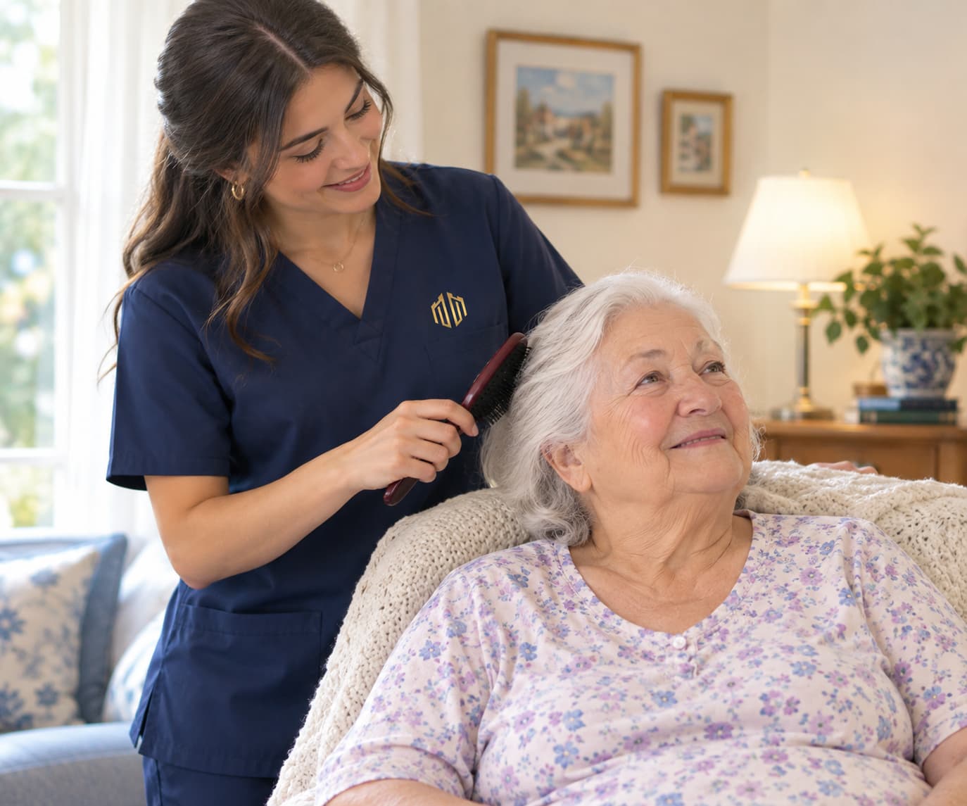 A caregiver brushing a resident’s hair, both of them smiling