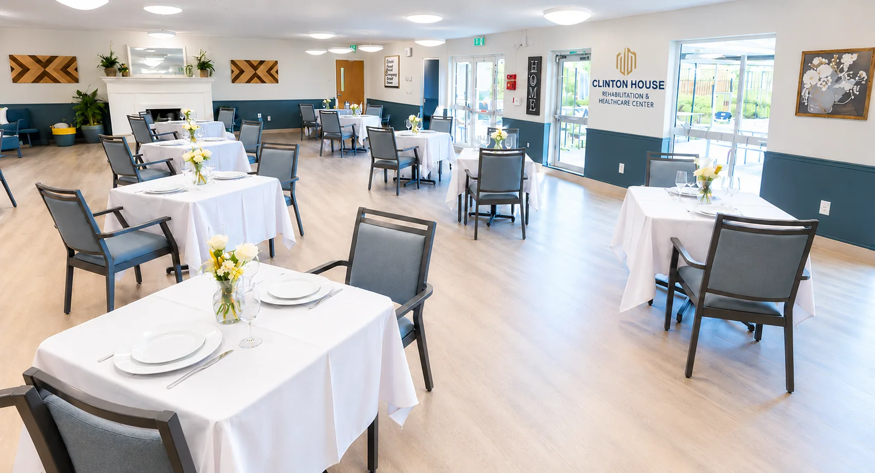 The bright dining room at Clinton House, tables laid for a meal