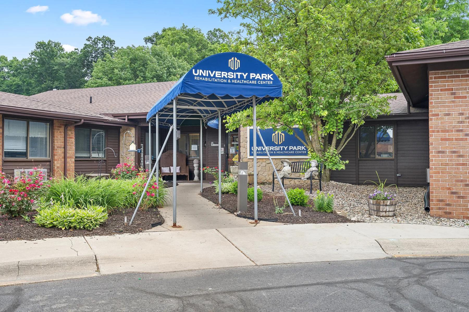 The entrance to University Park, under a blue awning