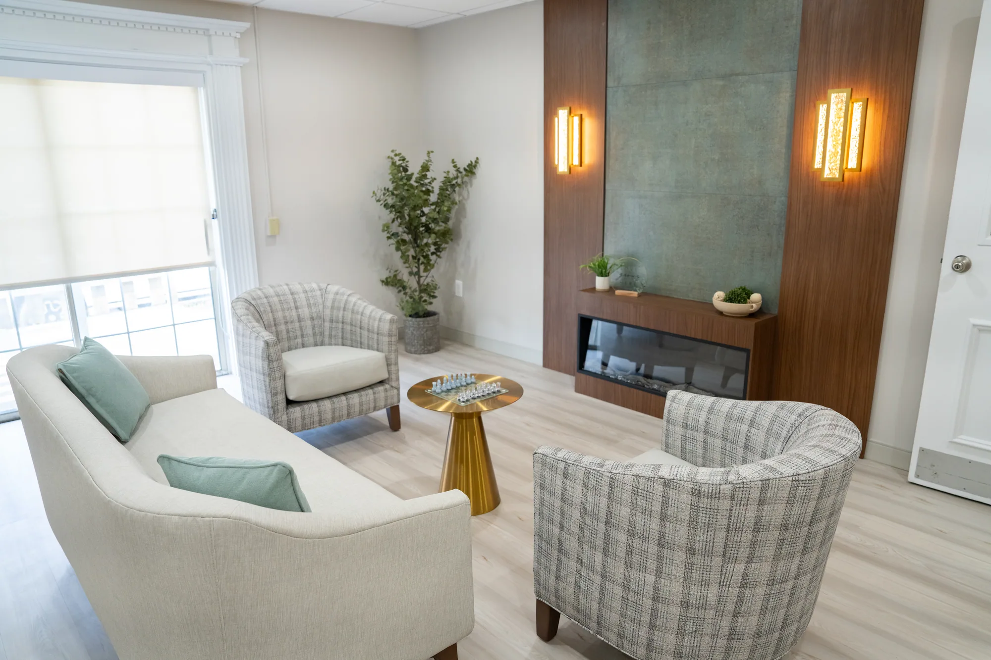 A seating area with armchairs beside a planted corner