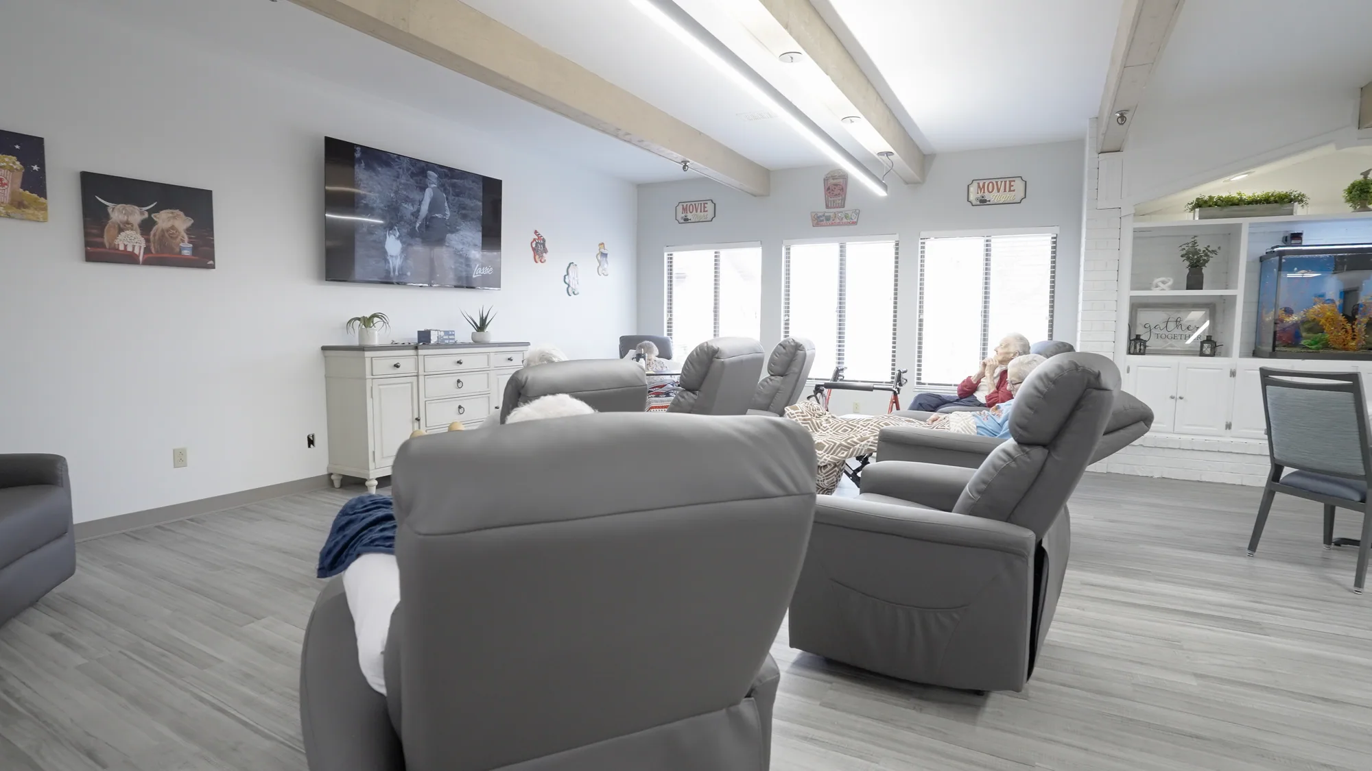 A lounge with sofas and armchairs beside the windows